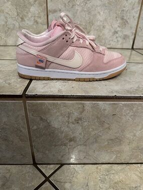 Nike Pink Low-Top Sneaker with Cream Swoosh and Gum Outsole